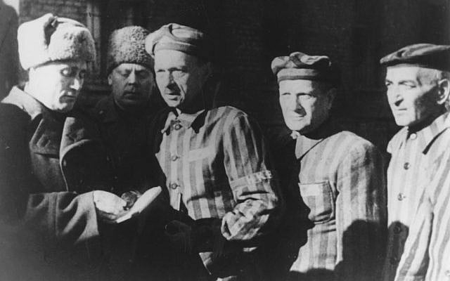 In this file photo dated January 1945, three Auschwitz prisoners, right, talk with Soviet soldiers after the Nazi concentration camp Auschwitz, in Poland, was liberated by the Russians. (Photo credit: AP/FILE) In this file photo dated January 1945, three Auschwitz prisoners, right, talk with Soviet soldiers after the Nazi concentration camp Auschwitz, in Poland, was liberated by the Russians. (Photo credit: AP/FILE)