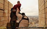A man accused of homosexuality is led to the edge of a tall building by Islamic State fighters before being hurled down to his death in January (screenshot)