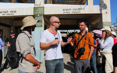 Aziz Abu Sarah (wearing a camera around his neck) at an entrance to the Western Wall (Courtesy Aziz Abu Sarah)