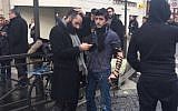 Tefillin at the ready at Paris siege, January 9, 2015 (photo credit: Michael Bloch via JTA)