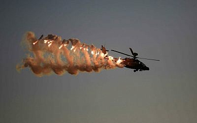 An illustrative photo of an Israel Air Force Apache helicopter, taken on December 25, 2014 at Hatzerim Air Base in Israel ( AP Photo/ Tsafrir Abayov)