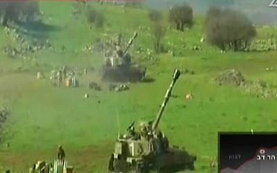 IDF artillery pieces fire into Lebanon after an attack on an Israeli border patrol, Wednesday, January 28, 2015 (screen capture: Channel 2)