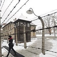 A visitor walks by barbed wire fences at the Auschwitz Nazi death camp in Oswiecim, Poland, Monday, Jan. 26, 2015. (AP/Alik Keplicz) A visitor walks by barbed wire fences at the Auschwitz Nazi death camp in Oswiecim, Poland, Monday, Jan. 26, 2015. (AP/Alik Keplicz)