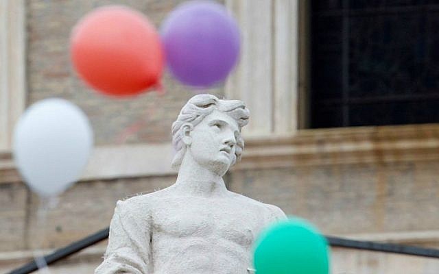 Colored balloons released by children fly next to a statue, at the end of the noon Angelus prayer recited by Pope Francis in St. Peter's Square at the Vatican, Sunday, Jan. 25, 2015. (photo credit: AP Photo/Gregorio Borgia) Colored balloons released by children fly next to a statue, at the end of the noon Angelus prayer recited by Pope Francis in St. Peter's Square at the Vatican, Sunday, Jan. 25, 2015. (photo credit: AP Photo/Gregorio Borgia)
