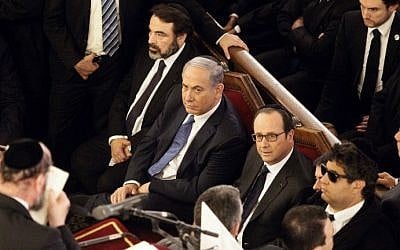 From left, The President of the Central Jewish Consistory of France, Joel Mergui, Israel's Prime Minister Benjamin Netanyahu and French President Francois Hollande attend a ceremony at the Grand Synagogue in Paris, on January 11, 2015 (photo credit: AFP/ POOL / MATTHIEU ALEXANDRE) 