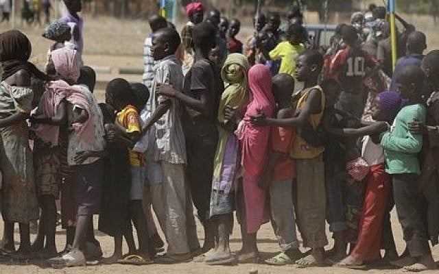 In this Thursday Nov. 27, 2014 photo, children displaced after attacks by Boko Haram, line up in the camp of internal displace people, in Yola, Nigeria. (AP Photo/Sunday Alamba, file) In this Thursday Nov. 27, 2014 photo, children displaced after attacks by Boko Haram, line up in the camp of internal displace people, in Yola, Nigeria. (AP Photo/Sunday Alamba, file)