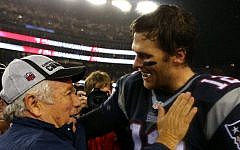 New England Patriots quarterback Tom Brady and owner Robert Kraft are all smiles after beating the Indianapolis Colts, January 2015. (Elsa/Getty Images/via JTA)