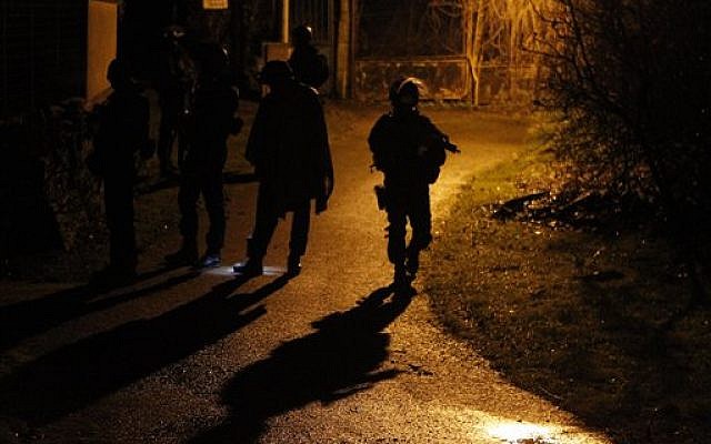 Armed police officers patrol in the village of Fleury, northeast of Paris, hunting down the two heavily armed brothers suspected in Wednesday's massacre at Charlie Hebdo newspaper, January 8, 2015. (photo credit: AP/Michel Spingler) Armed police officers patrol in the village of Fleury, northeast of Paris, hunting down the two heavily armed brothers suspected in Wednesday's massacre at Charlie Hebdo newspaper, January 8, 2015. (photo credit: AP/Michel Spingler)