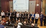 IBM executives and members of the first and second groups in the Alpha Zone Accelerator cut a blue ribbon inaugurating the second accelerator class, January 2015  (Courtesy)