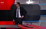 An armed man entered Dutch national broadcaster  NOS demanding airtime, on January 29, 2015 (photo credit: YouTube screen capture)