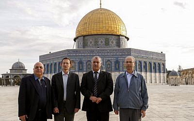 Hadash Knesset members (from left) Afu Agbaria, Dov Khenin, Mohammad Barakeh and Hana Sweid pose in front of the Done of the Rock on Jerusalem's Temple Mount, November 27, 2013. (Sliman Khader/Flash90)