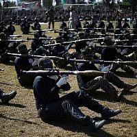 Palestinian youth show their skills during a graduation ceremony as part of a training camp run by the Hamas movement on January 29, 2015 in Khan Yunis, in the southern Gaza Strip. (AFP photo/Said Khatib) Palestinian youth show their skills during a graduation ceremony as part of a training camp run by the Hamas movement on January 29, 2015 in Khan Yunis, in the southern Gaza Strip. (AFP photo/Said Khatib)