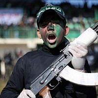 A Palestinian youth holds a weapon during a graduation ceremony as part of a training camp run by the Hamas movement on January 29, 2015 in Khan Yunis, in the southern Gaza Strip. (AFP photo/Said Khatib) A Palestinian youth holds a weapon during a graduation ceremony as part of a training camp run by the Hamas movement on January 29, 2015 in Khan Yunis, in the southern Gaza Strip. (AFP photo/Said Khatib)