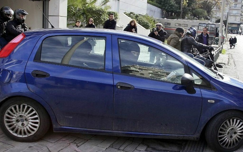 Anti-terrorist police look out from a car during the transfer of Algerian man from the Athens Appeals court on January 20, 2015 (photo credit: AFP/MAX GYSENLICK) Anti-terrorist police look out from a car during the transfer of Algerian man from the Athens Appeals court on January 20, 2015 (photo credit: AFP/MAX GYSENLICK)