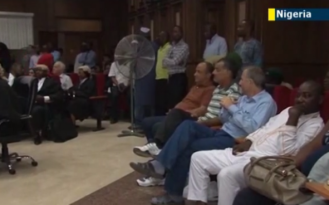 Talal Ahmad Roda and two other men accused of being Hezbollah operatives sit in a Nigerian courtroom in 2013. (screen capture: YouTube/JewishNewsOne) Talal Ahmad Roda and two other men accused of being Hezbollah operatives sit in a Nigerian courtroom in 2013. (screen capture: YouTube/JewishNewsOne)