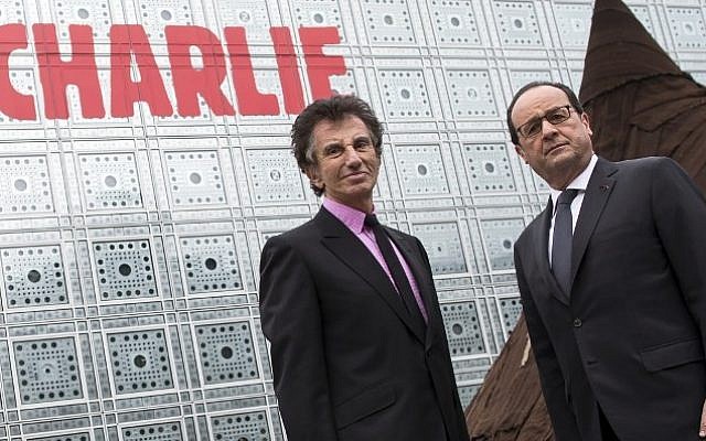 French President Francois Hollande (R) and the president of the Institut du Monde Arabe (Arab Institute), Jack Lang (L), pose in front of the Arab Institute building bearing the message 'We are Charlie', on January 15, 2015. (Photo credit: AFP/ IAN LANGSDON) French President Francois Hollande (R) and the president of the Institut du Monde Arabe (Arab Institute), Jack Lang (L), pose in front of the Arab Institute building bearing the message 'We are Charlie', on January 15, 2015. (Photo credit: AFP/ IAN LANGSDON)