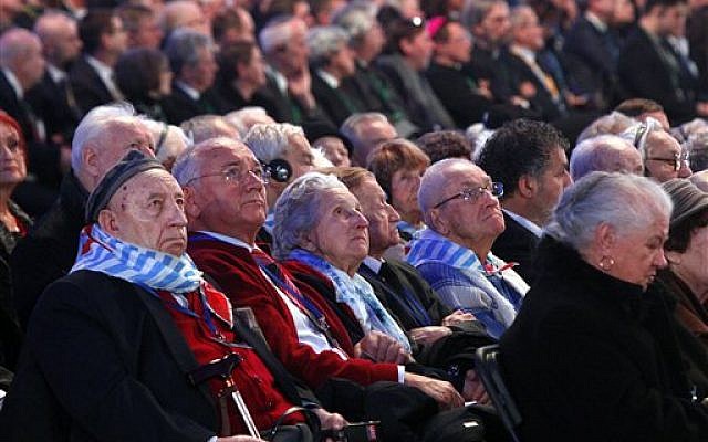 Holocaust survivors watch suspended screens in a tent raised at the entrance of the Birkenau Nazi death camp in Oswiecim, Poland, Tuesday, Jan. 27, 2015, during the official remembrance ceremony. (photo credit: AP Photo//Czarek Sokolowski) Holocaust survivors watch suspended screens in a tent raised at the entrance of the Birkenau Nazi death camp in Oswiecim, Poland, Tuesday, Jan. 27, 2015, during the official remembrance ceremony. (photo credit: AP Photo//Czarek Sokolowski)