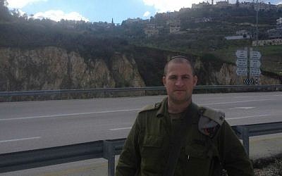 Maj. Irad Hershkovitz, the Shomron Regional Brigade demolitions officer, near Jit Junction in the northern West Bank on January 5, 2014 (photo credit: Mitch Ginsburg/ Times of Israel)