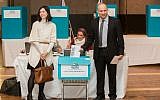 Jewish Home party leader Naftali Bennett (R) and his wife, Gilat seen cast their vote during the party's preliminary elections, in Jerusalem, on January 14, 2014 (photo credit: Yonatan Sindel/Flash90)