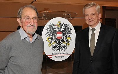 Martin Karplus, left, and Austria’s U.S. ambassador, Hans Peter Manz, at the opening of an exhibition of Karplus’ photographs at the Austrian Embassy in Washington, Jan. 14, 2015. (Peter Cutts/Austrian Cultural Forum/JTA)
