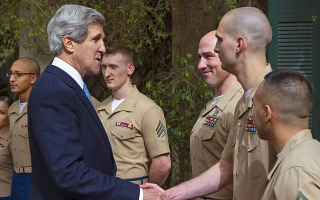 US Secretary of State John Kerry with US Marines in the Jerusalem Consulate on April 8, 2013 (photo credit: AP Photo: Paul J. Richards/ Pool)