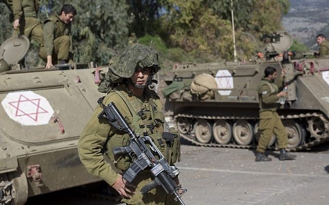 IDF soldiers secure the Israel-Lebanon border, Wednesday, Jan. 28, 2015 after Hezbollah attacked an Israeli military convoy, killing two soldiers. (Photo credit: AP/Ariel Schalit)