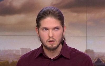 Lilian Lepère, who survived being taken hostage by the Kouachi brothers by hiding under a sink at a printing press outside Paris, speaking on France 2 about his ordeal, on January 13, 2015. (photo credit: Screen capture)