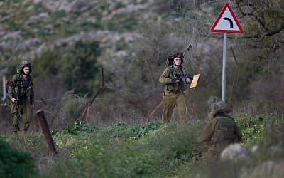 Israeli soldiers operating in the Mount Dov region on January 28, 2015, shortly after two soldiers were killed in a Hezbollah ambush (photo credit: AP Photo/ Ariel Schalit)