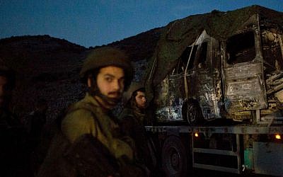 The charred remains of what appears to be a Citroen Berlingo, struck by Hezbollah forces on January 28, 2015. (photo credit: AP/Ariel Schalit)