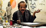 In this photograph taken on January 9, 2015, Pakistani cartoonist Rafique Ahmad, alias "FEICA" draws at his office in Karachi. In the face of Pakistan's prolific use of blasphemy laws and a culture of political violence, cartoonists must tread a thin line (photo credit: AFP / Asif Hassan)