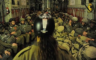 IDF Paratroopers on board a C-130 Hercules, equipped with gear pouch and ready to be linked to a static line in the plane on January 17, 2012 (photo credit: IDF Spokesperson's Unit)