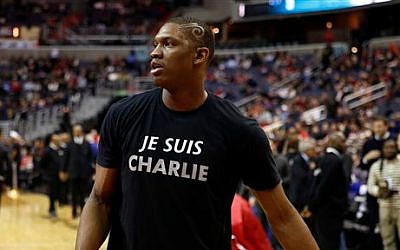 Washington Wizards center Kevin Seraphin, from France, wears a 'Je Suis Charlie' T-shirt during warmups for an NBA basketball game against the Chicago Bulls, Friday, Jan. 9, 2015, in Washington (photo credit: AP/Alex Brandon) 