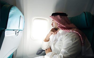 Men will still be allowed to sit with their wives. (illustrative Saudi passenger image via Shutterstock)