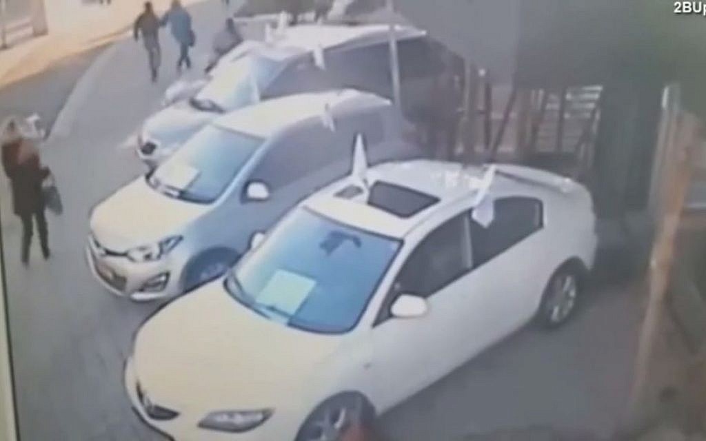 Screen capture from a video which appears to show a Palestinian man stab an Israeli woman in the back in Tel Aviv on January 21, 2015. (screen capture: YouTube)