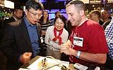 Tuvia Elbaum (right) shows off ZUtA Labs' printing technology to Dr. Harry Shum, executive vice president of technology and research, Microsoft. (photo credit: Courtesy)
