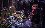 Well-wishers bring flowers and light candles to honor the shooting victims outside the main Synagogue in Copenhagen, Denmark on February 15, 2015. (AFP/Odd Andersen)