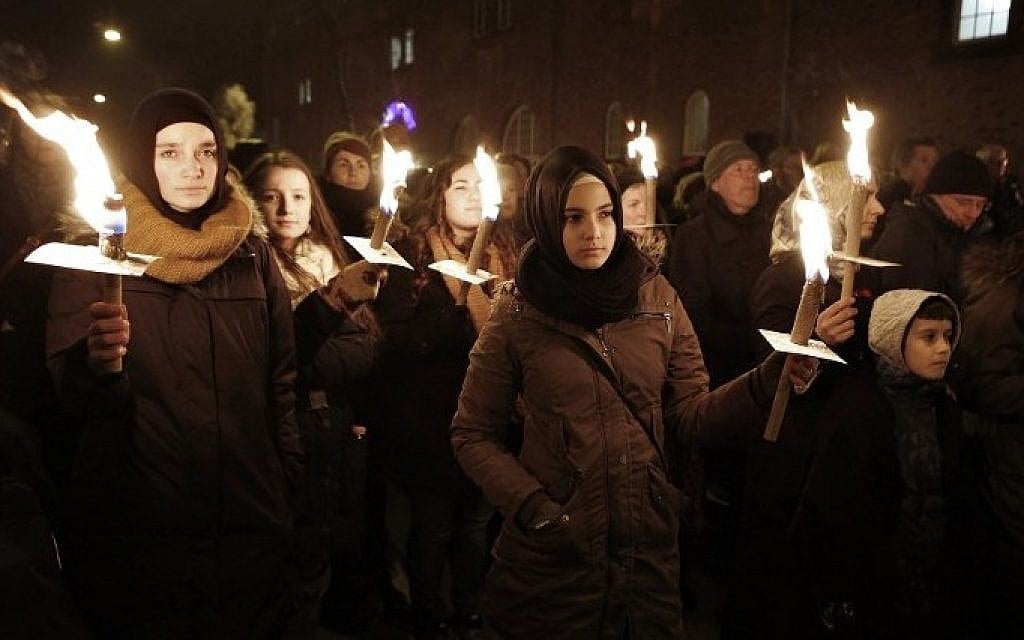 People hold candles during a memorial service for those killed by a gunman in Copenhagen, February 16, 2015 (Photo credit: Bax Lindhardt/Scanpix Denmark/AFP) People hold candles during a memorial service for those killed by a gunman in Copenhagen, February 16, 2015 (Photo credit: Bax Lindhardt/Scanpix Denmark/AFP)