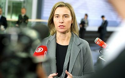 Federica Mogherini speaks with journalists prior to an Informal Meeting of EU Defense Ministers in Riga, Latvia on February 18, 2015. photo credit: AFP/ILMARS ZNOTINS)