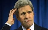 US Secretary of State John Kerry gestures as he speaks during a media briefing at the US Embassy in London on February 21, 2015. (photo credit: AFP/ Neil Hall/Pool)