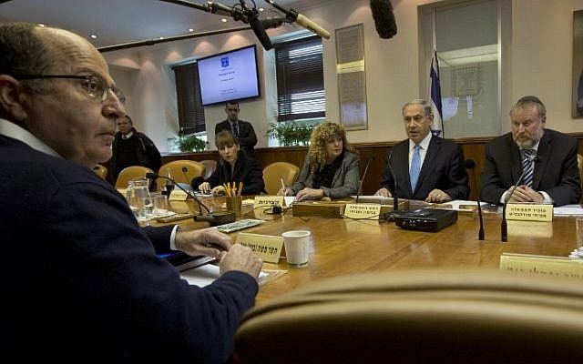 Israeli Prime Minister Benjamin Netanyahu sits in front of Defense Minister Moshe Yaalon, foreground, as he chairs the weekly cabinet meeting at his Jerusalem office on February 8, 2015. (photo credit: AFP/POOL/SEBASTIAN SCHEINER) Israeli Prime Minister Benjamin Netanyahu sits in front of Defense Minister Moshe Yaalon, foreground, as he chairs the weekly cabinet meeting at his Jerusalem office on February 8, 2015. (photo credit: AFP/POOL/SEBASTIAN SCHEINER)