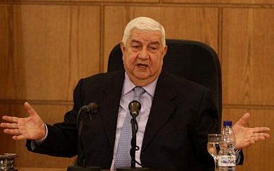 Syrian Deputy Prime Minister and Foreign Minister Walid Moallem speaks during a news conference with Minister of Foreign Affairs of Belarus Vladimir Makei in Damascus on February 9, 2015. (photo credit: AFP/LOUAI BESHARA)