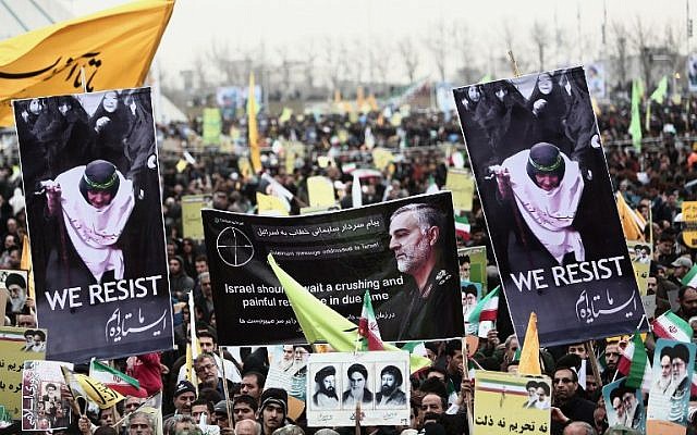 Iranian demonstrators hold a portrait of Maj. Gen. Qassem Soleimani, commander of the Quds Force in the Iranian Revolutionary Guards and a central figure in the violent spread of Iran's revolution. Photo taken in Tehran's Azadi Square, February 11, 2015. (Behrouz Mehri/AFP) Iranian demonstrators hold a portrait of Maj. Gen. Qassem Soleimani, commander of the Quds Force in the Iranian Revolutionary Guards and a central figure in the violent spread of Iran's revolution. Photo taken in Tehran's Azadi Square, February 11, 2015. (Behrouz Mehri/AFP)