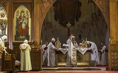 Egypt's Coptic Pope Tawadros II (C) leads a mass to honor the memory of the Egyptian Coptic Christians murdered by Islamic State (IS) terrorists in Libya on February 17, 2015 at Saint-Mark's Coptic Cathedral in Cairo's al-Abbassiya district. (photo credit: Khaled Desouki/AFP) 