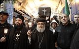 Christians take part in a symbolic funeral procession in Jerusalem's Old City on February 18, 2015, for the 21 Egyptian Coptic Christians beheaded by the Islamic State (IS) group on a Libyan beach. (photo credit: AFP PHOTO / AHMAD GHARABLI)