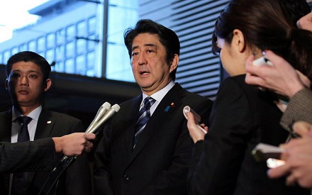 Japanese Prime Minister Shinzo Abe speaks to reporters at his official residence in Tokyo on February 1, 2015. (photo credit: AFP PHOTO / Yoshikazu TSUNO) Japanese Prime Minister Shinzo Abe speaks to reporters at his official residence in Tokyo on February 1, 2015. (photo credit: AFP PHOTO / Yoshikazu TSUNO)