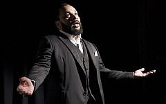 French comedian Dieudonne M’bala M’bala delivering a speech, January 15, 2012. (AFP/Patrick Kovarik)
