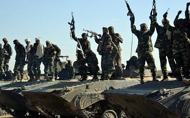 Chadian troops gather on February 1, 2015 near the Nigerian town of Gamboru, just accros the border from Cameroon. In a deserted Gamboru, Chadian forces carried out clean-up operations after entering the town and retaking it from Boko Haram, which seized control months ago. (AFP/MARLE) Chadian troops gather on February 1, 2015 near the Nigerian town of Gamboru, just accros the border from Cameroon. In a deserted Gamboru, Chadian forces carried out clean-up operations after entering the town and retaking it from Boko Haram, which seized control months ago. (AFP/MARLE)