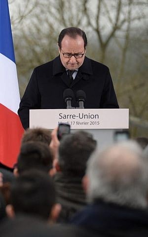 French President Francois Hollande delivers a speech during a ceremony at the Jewish cemetery in Sarre-Union, eastern France, on February 17, 2015, following the desecration of around 300 tombs. (photo credit: Patrick Hertzog/AFP) 