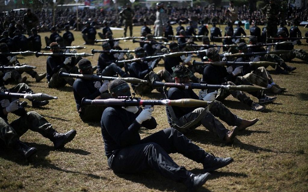 Palestinian youth show their skills during a graduation ceremony as part of a training camp run by the Hamas movement on January 29, 2015 in Khan Yunis, in the southern Gaza Strip. (AFP photo/Said Khatib)