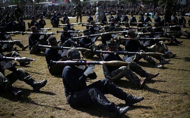 Palestinian youth show their skills during a graduation ceremony as part of a training camp run by the Hamas movement on January 29, 2015 in Khan Yunis, in the southern Gaza Strip. (AFP photo/Said Khatib) Palestinian youth show their skills during a graduation ceremony as part of a training camp run by the Hamas movement on January 29, 2015 in Khan Yunis, in the southern Gaza Strip. (AFP photo/Said Khatib)
